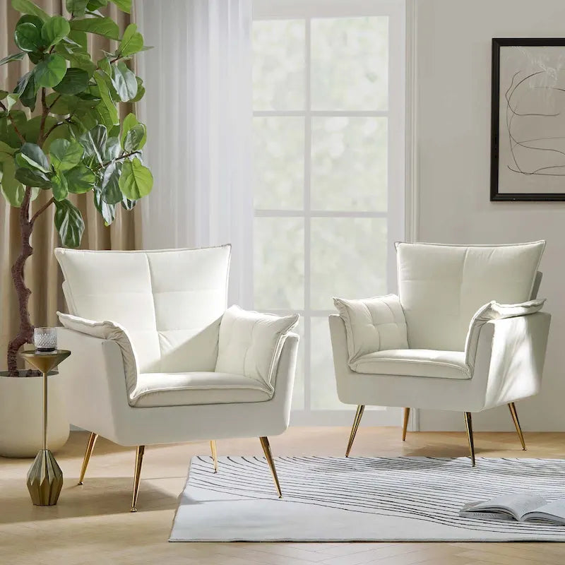 Modern velvet-cushioned armchairs with gold-tone metal legs, two-piece set.