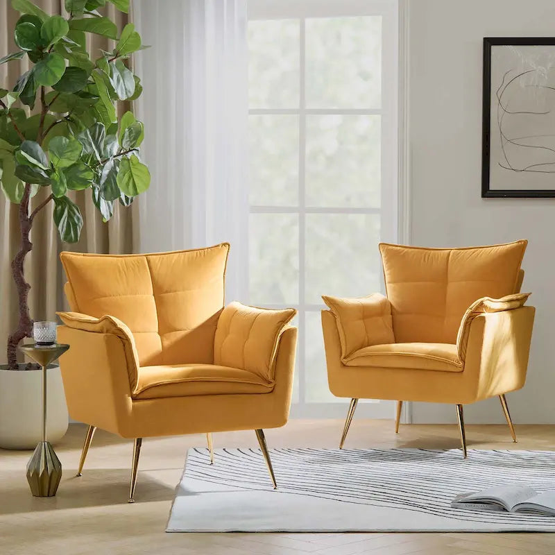 Modern velvet-cushioned armchairs with gold-tone metal legs, two-piece set.