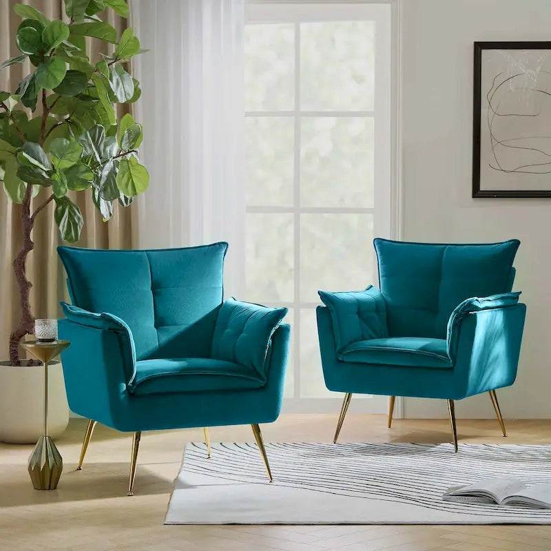 Modern velvet-cushioned armchairs with gold-tone metal legs, two-piece set.