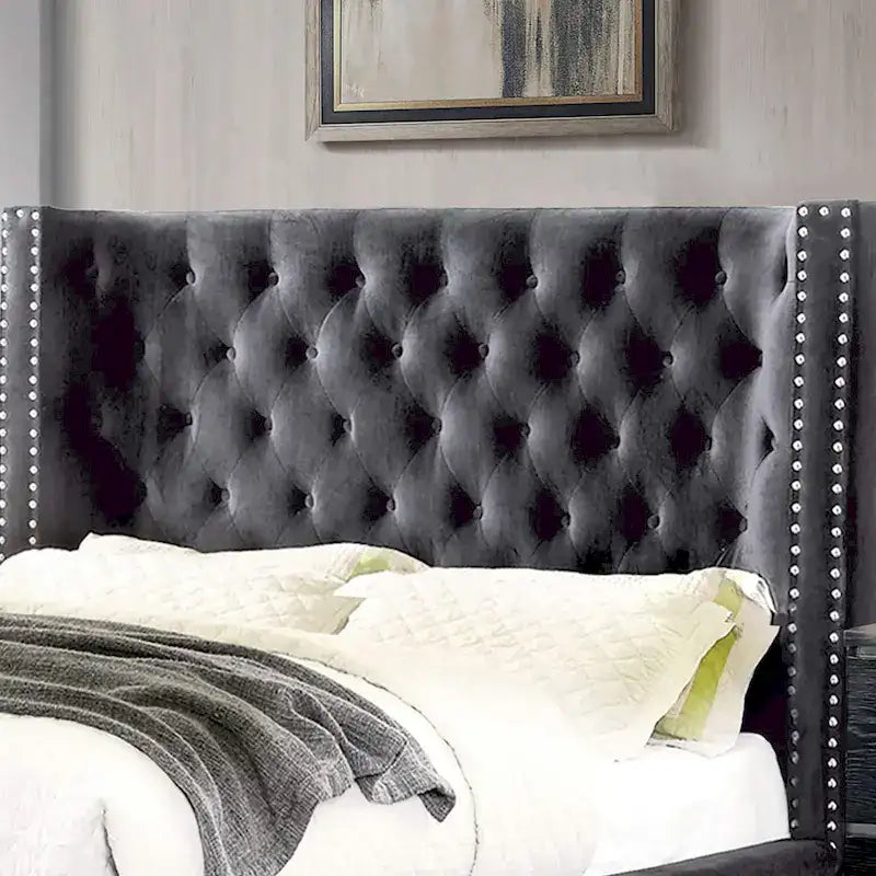 Gray tufted fabric wingback bed
