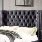 Gray tufted fabric wingback bed